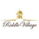 Riddle Village company logo